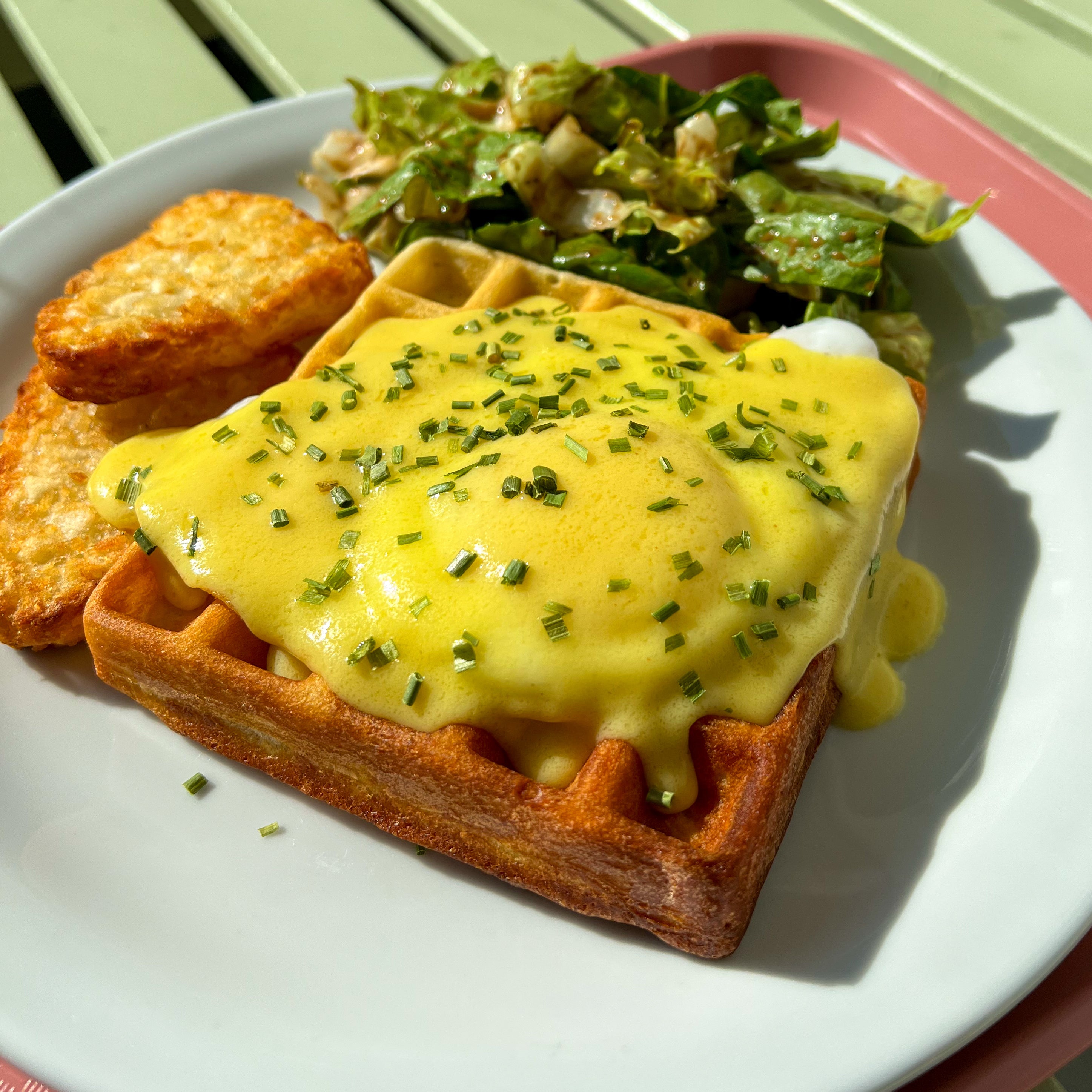 Sunny Benny Waffle with fresh crack sunny side up egg and hollandaise sauce at Nana's Creperie. Perfect brunch option near you.